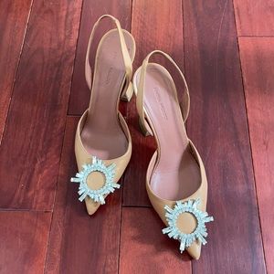 Amina Muaddi sling back beautiful high heals.